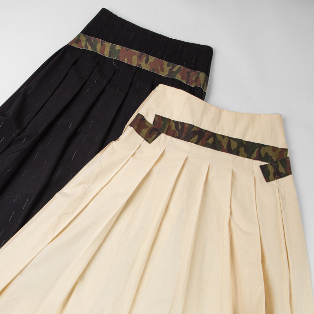 COMME DES GARCONS CAMO SWITCHED PLEATS SKIRTS